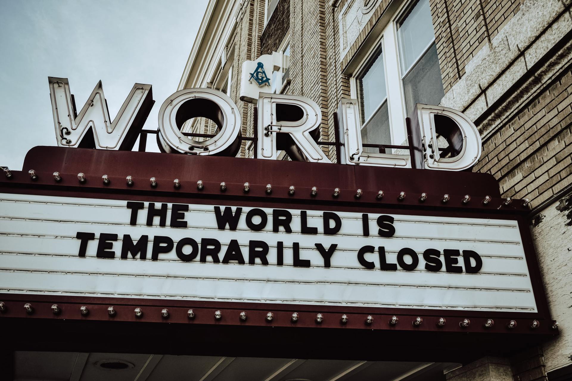 A sign that says the world is temporarily closed