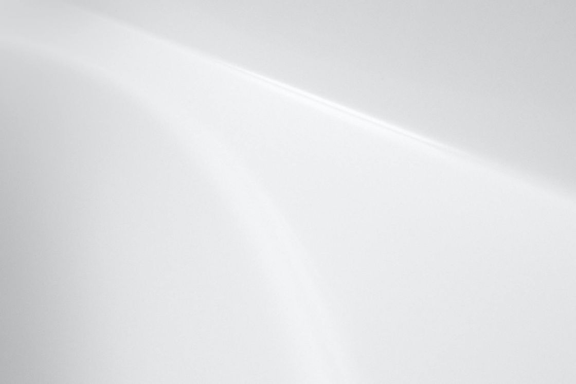 Abstract white surface with light and shadow play.