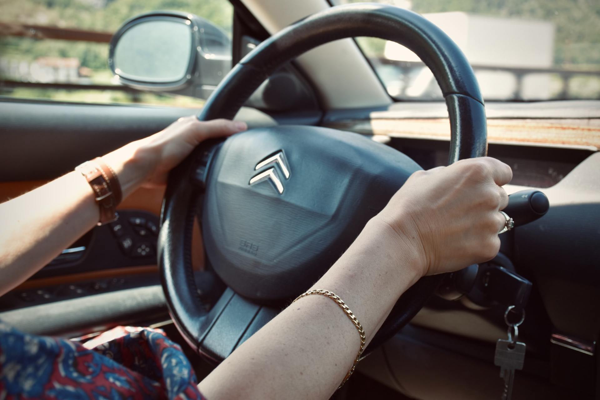 hands on a steering wheel