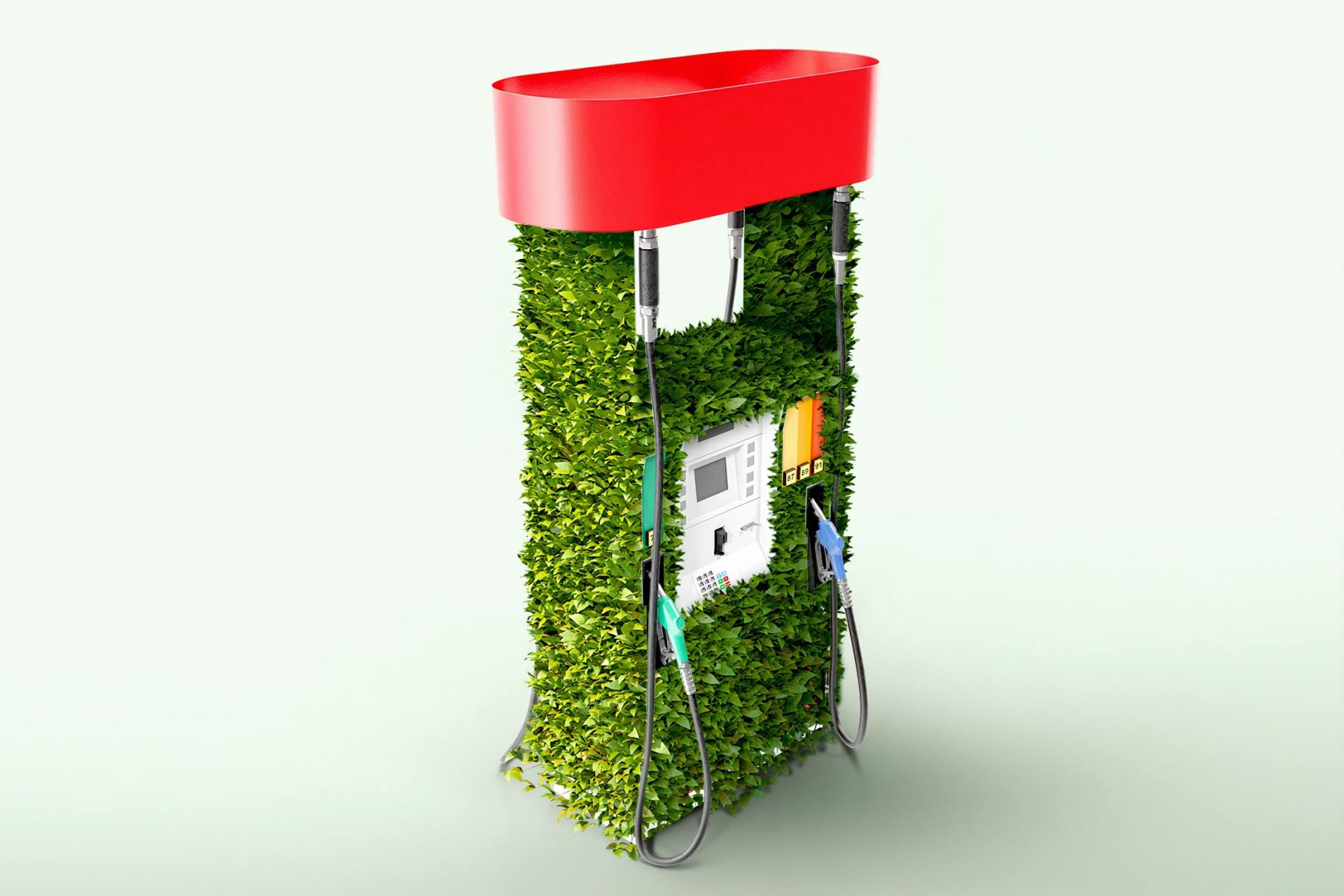 A gas pump made out of grass with a red roof.