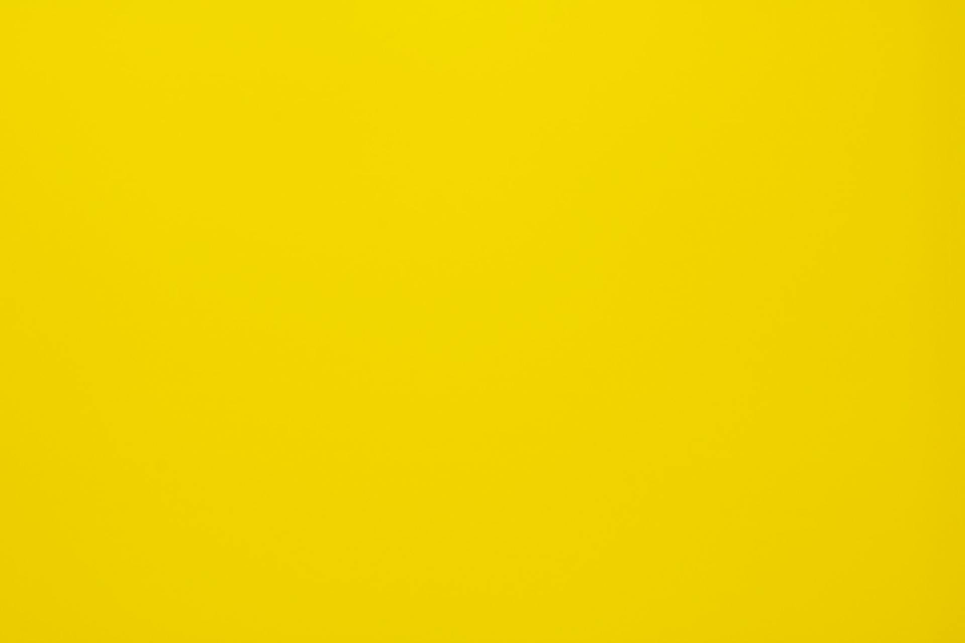 A close up of a bright yellow background.