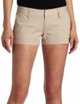Beige shorts on a person standing against a white background