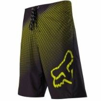 Black and yellow Fox Racing mountain bike shorts with logo on the leg