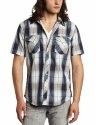Person wearing a blue-and-white plaid short-sleeve button-up shirt and gray pants