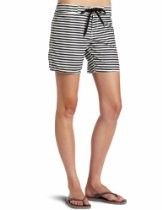 Black-and-white striped shorts worn with flip-flops on a white background