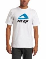 Person wearing a white T-shirt with a blue REEF logo and dark pants.