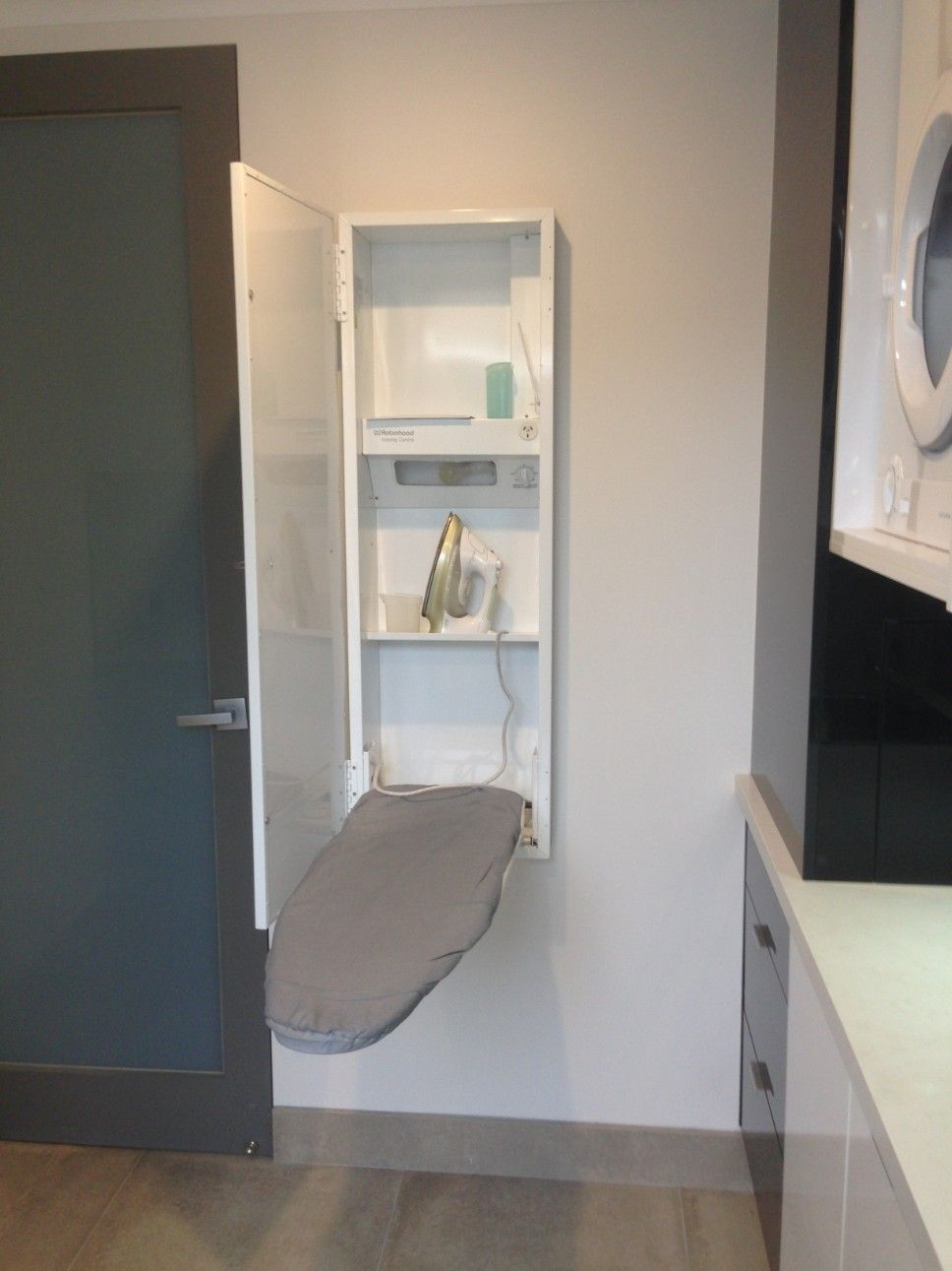 An Ironing Board is Mounted to the Wall in a Cabinet — High Kraft Kitchens and Joinery in Berkeley, NSW