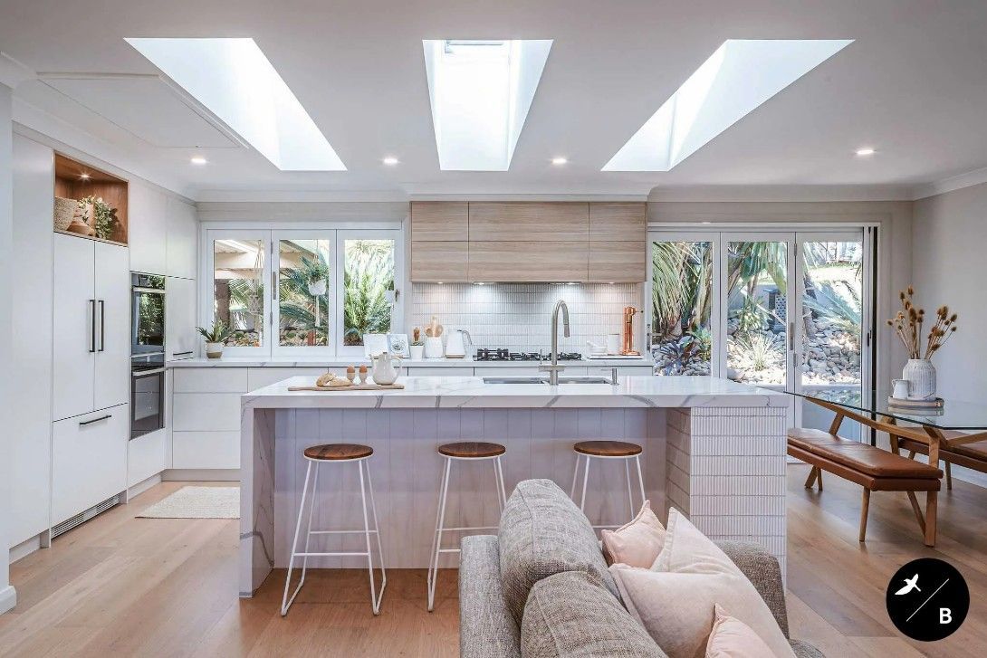 A Kitchen Room With a Couch, Stools, and a Kitchen — High Kraft Kitchens and Joinery in Berkeley, NSW