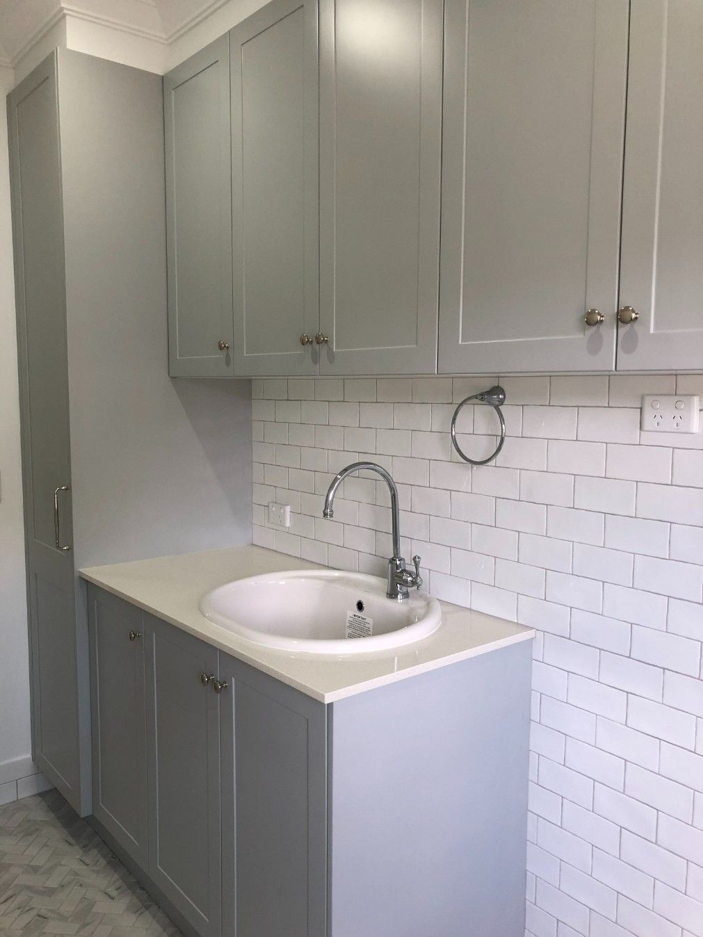 A Laundry Room With a Washer and Dryer and a Sink — High Kraft Kitchens and Joinery in Berkeley, NSW
