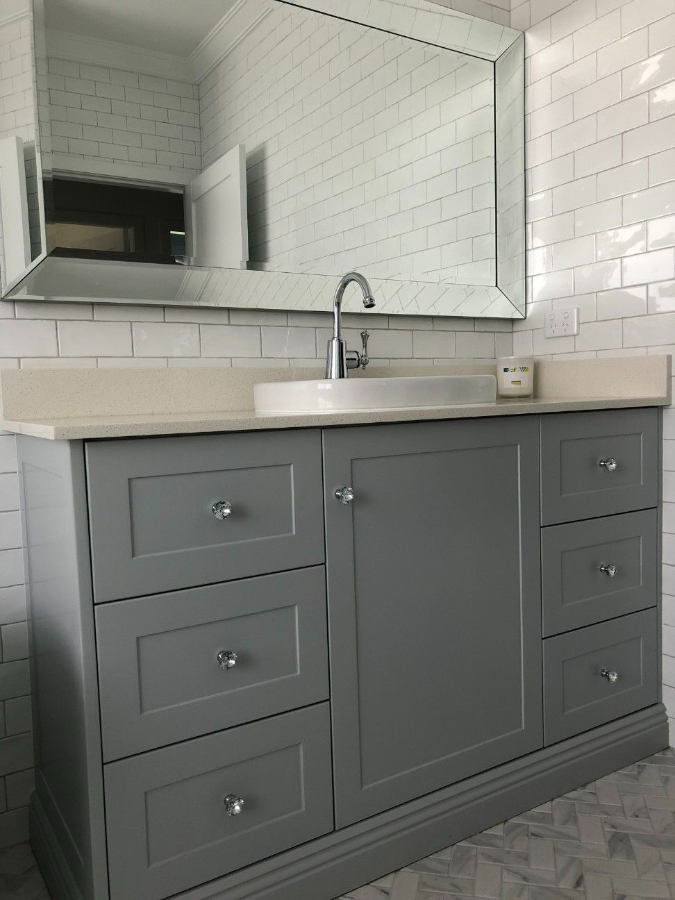 A Bathroom Vanity With a Sink and a Mirror — High Kraft Kitchens and Joinery in Berkeley, NSW