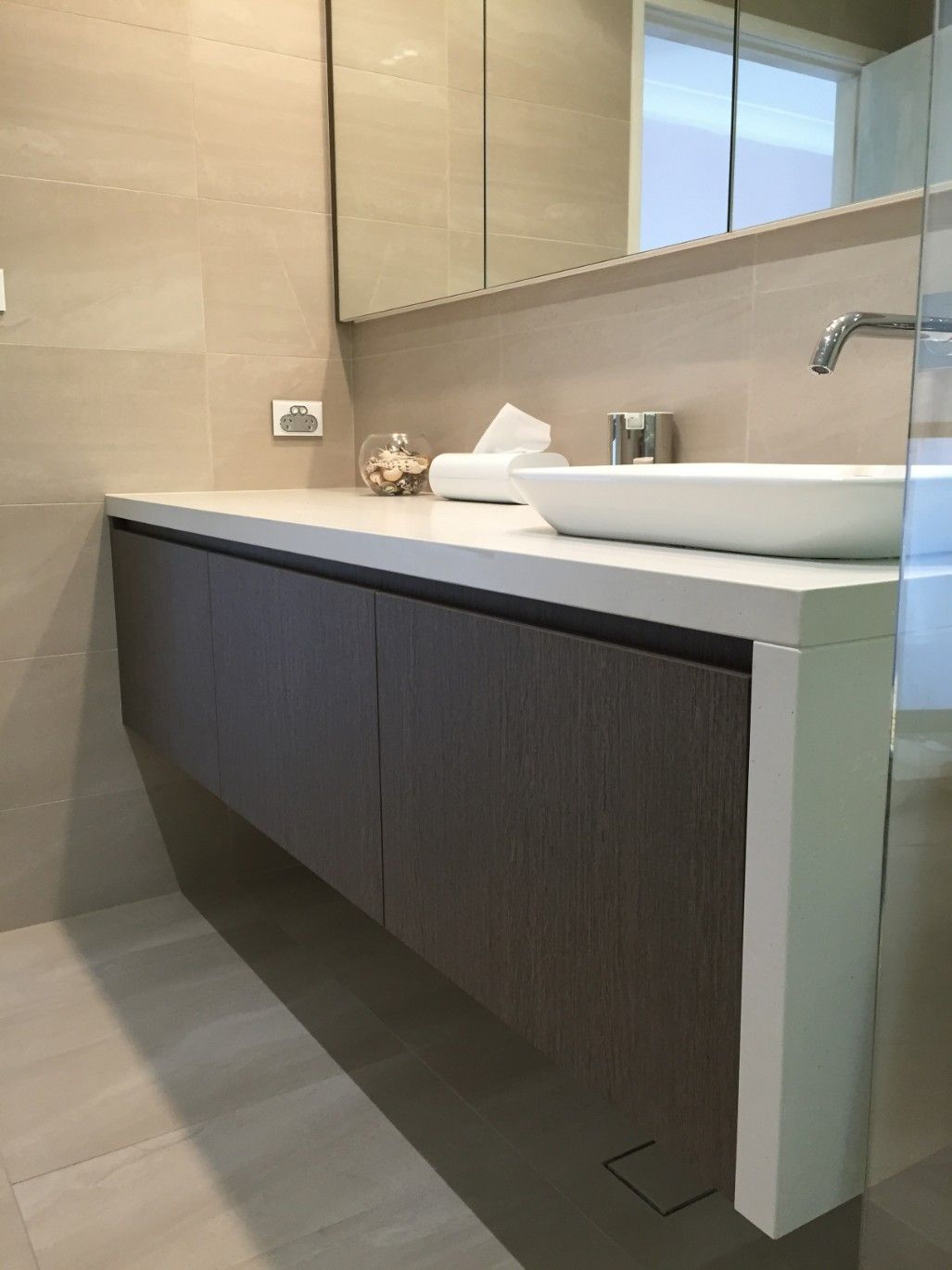 A Bathroom With a Sink and a Mirror on the Wall — High Kraft Kitchens and Joinery in Berkeley, NSW