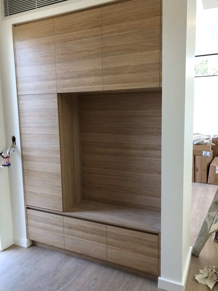 A Wooden Cabinet With Drawers and a Bench in a Room — High Kraft Kitchens and Joinery in Berkeley, NSW