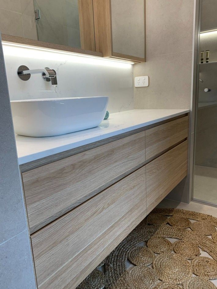 A Bathroom With a Sink and a Mirror — High Kraft Kitchens and Joinery in Berkeley, NSW
