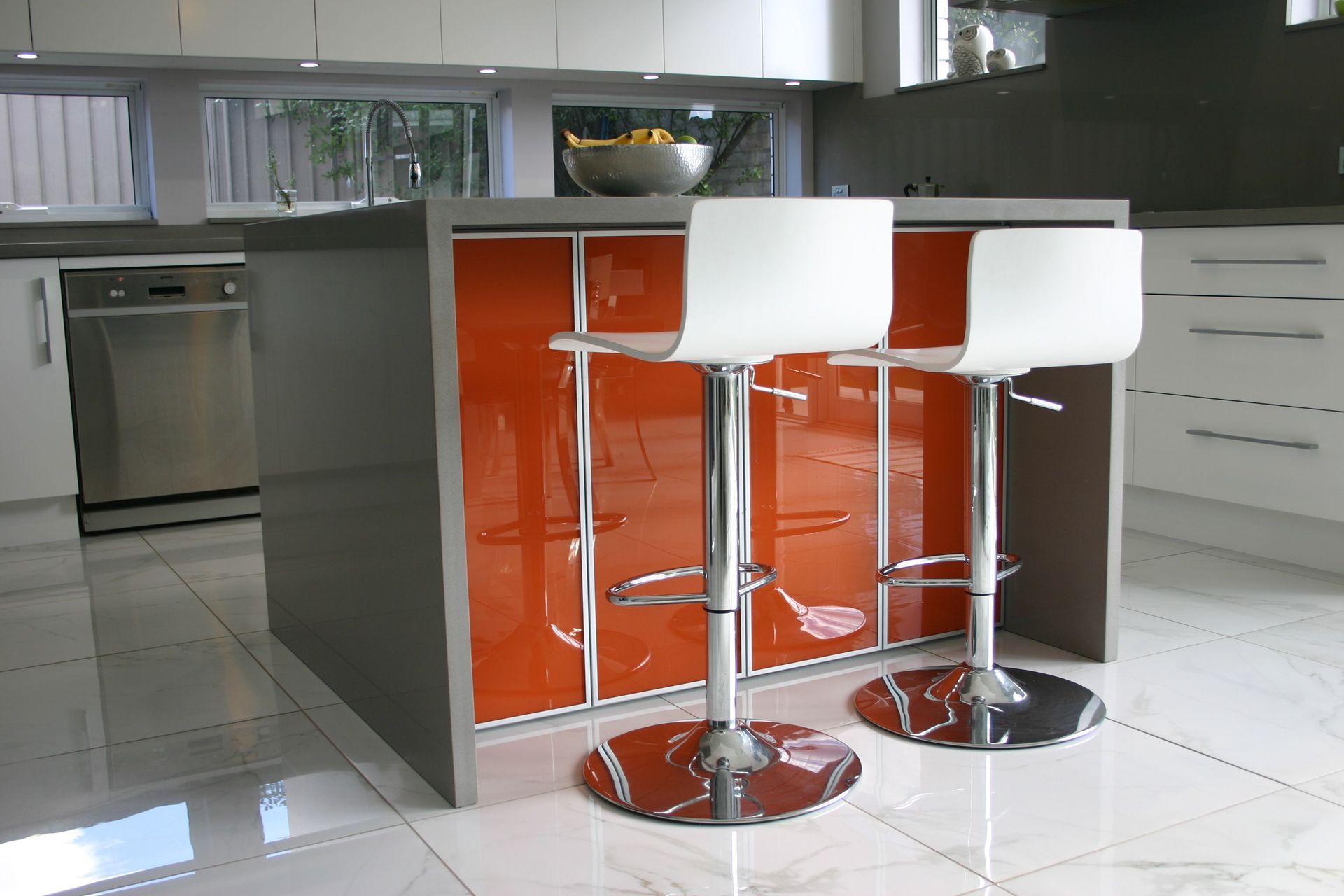 A Kitchen With Red Back Splash and Stools — High Kraft Kitchens and Joinery in Berkeley, NSW