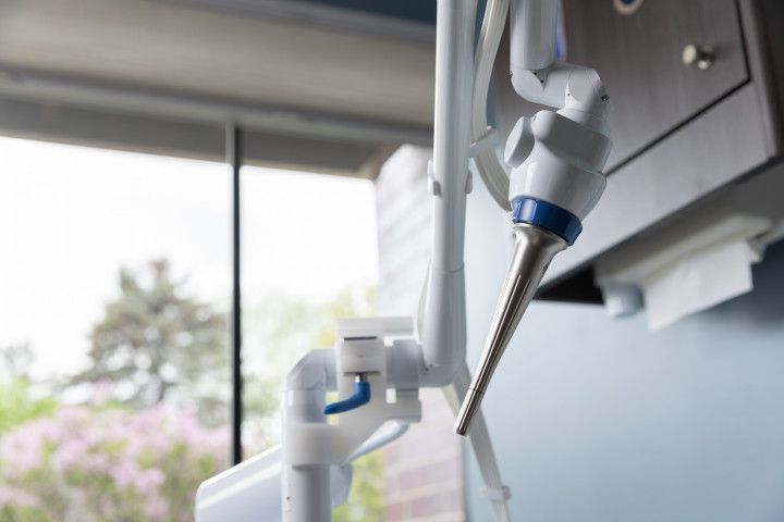 Dental drill close-up in a bright clinic with window light