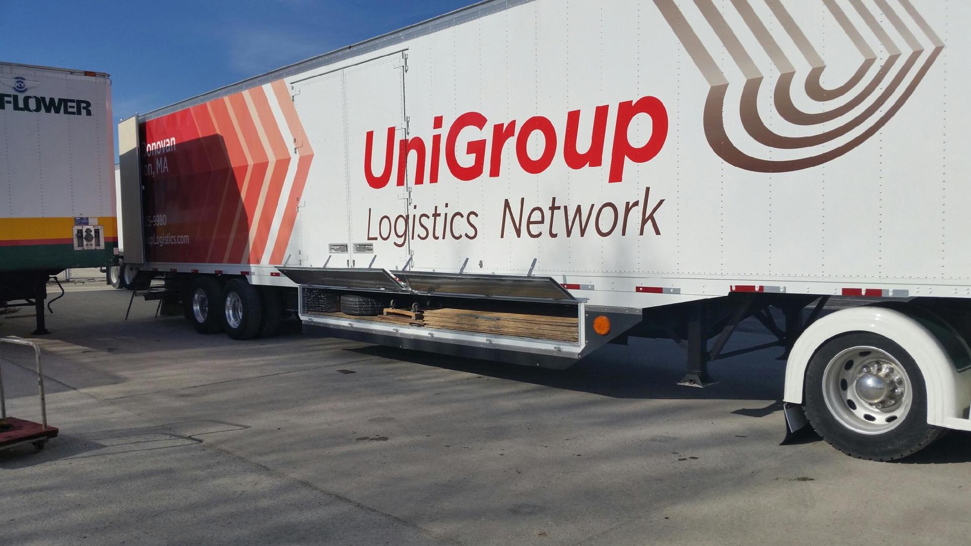 UniGroup Logistics Network semi-trailer parked outdoors on pavement