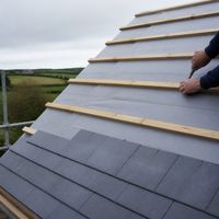 Breathable roof membrane under timber battens and new slates on a pitched roof in Ireland
