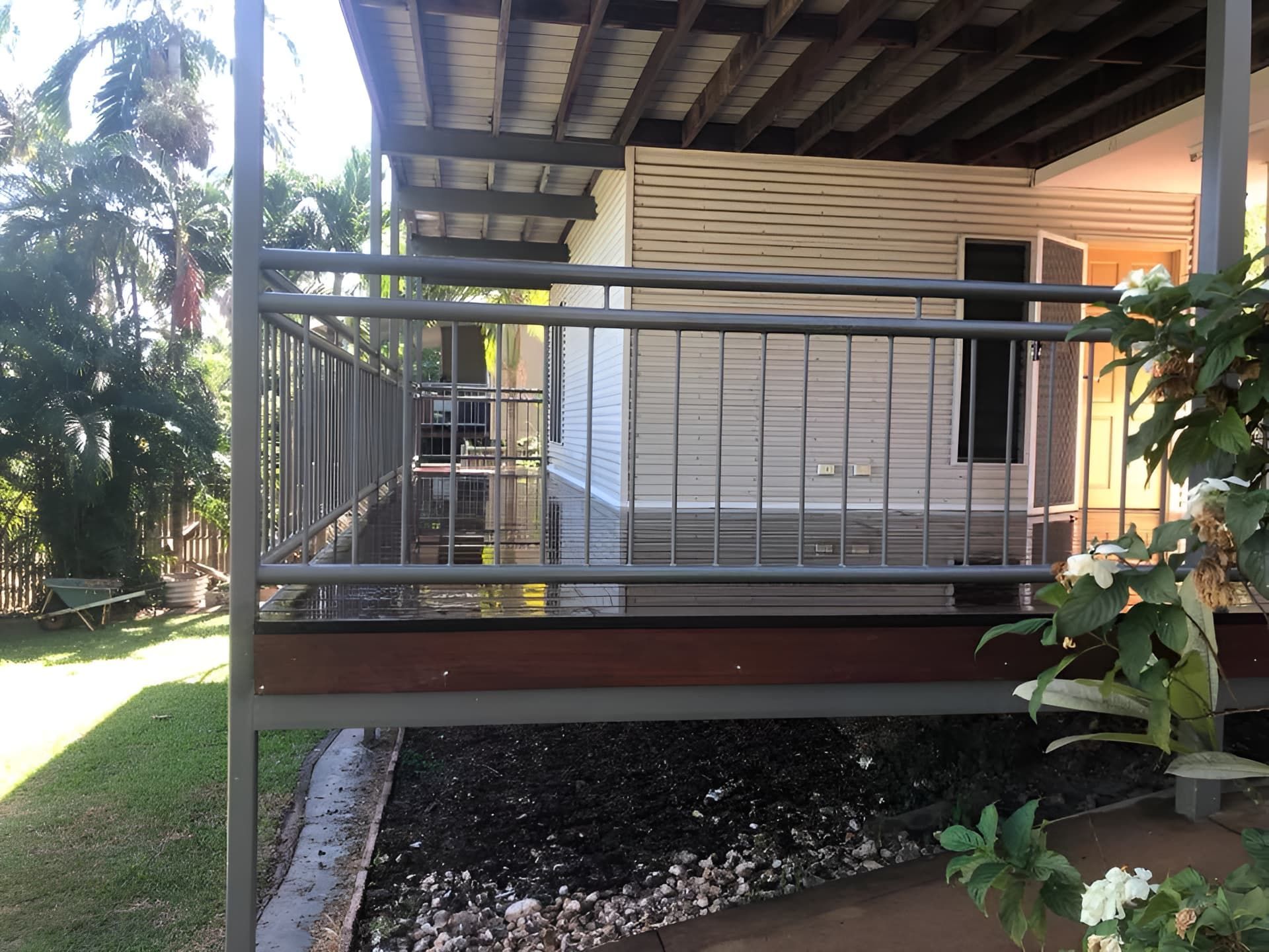 a verandah with green grass and garden around it — Northco Constructions In Nightcliff, NT