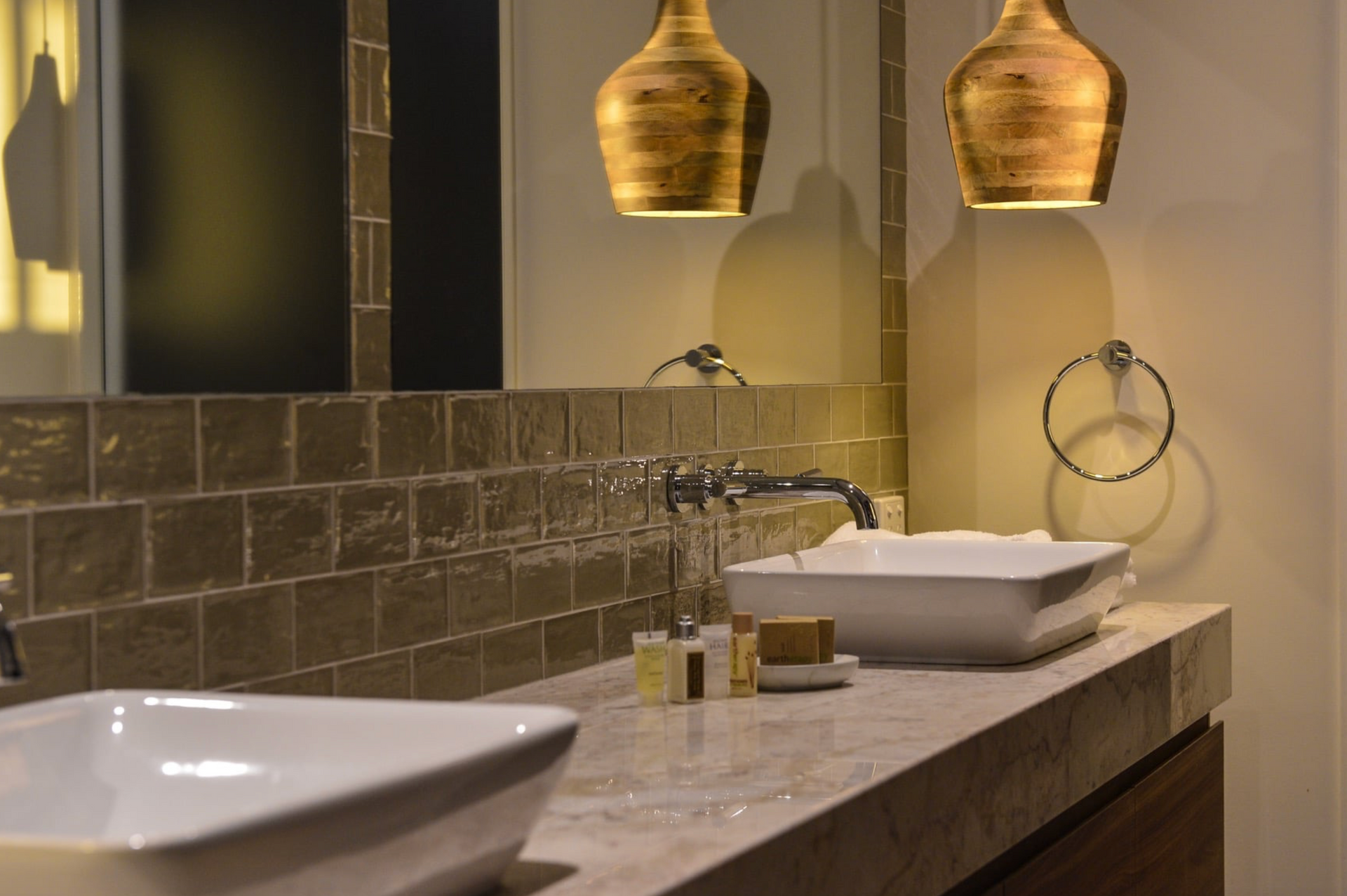 Bathroom With Two Sinks, a Mirror, and Gold Pendant Lights — Northco Constructions In Muirhead, NT