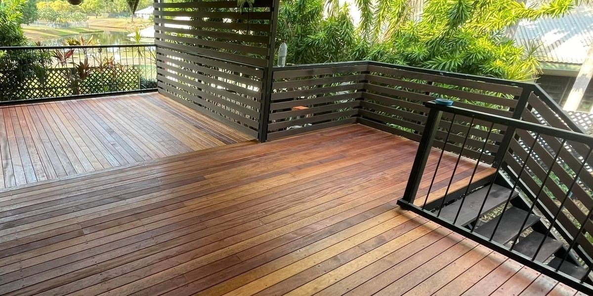 Wooden Deck With Dark Wooden Railings, Looking Out to a Lush Green — Northco Constructions In Muirhead, NT