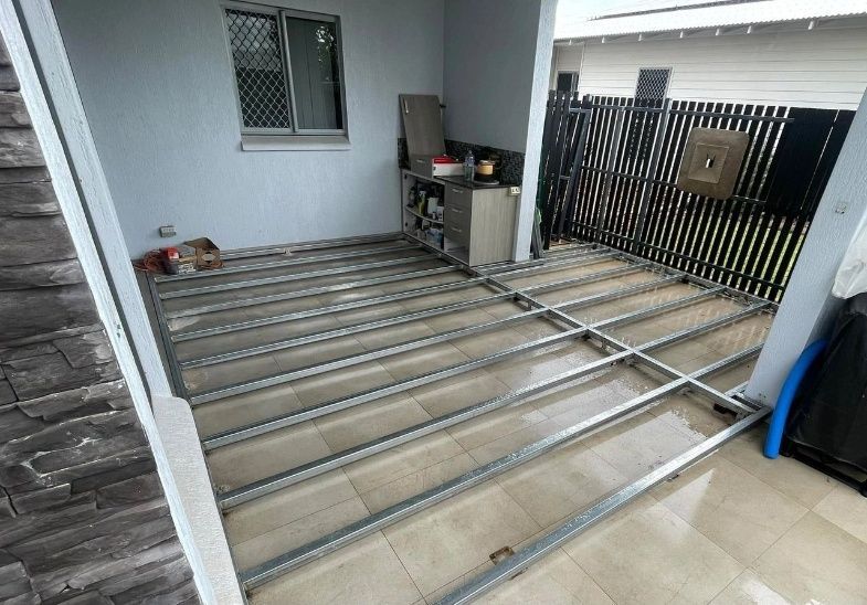 Metal Deck Frame Under Construction on a Patio With a Fence — Northco Constructions In Muirhead, NT