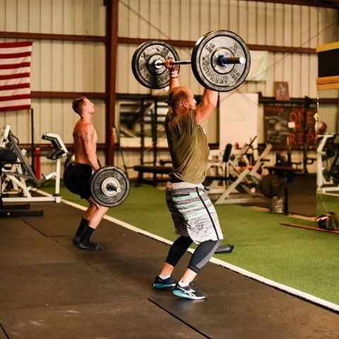 Lifting Weights At A Gym — St. Augustine, FL — Amp Hardcore Gym