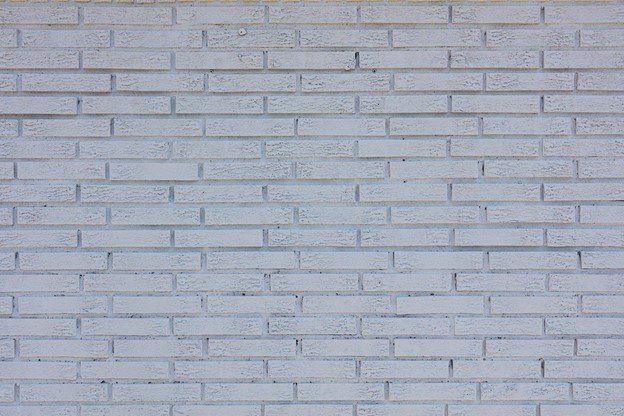 A close up of a white brick wall | Siefken Roofing and Remodeling Services in Omaha, NE