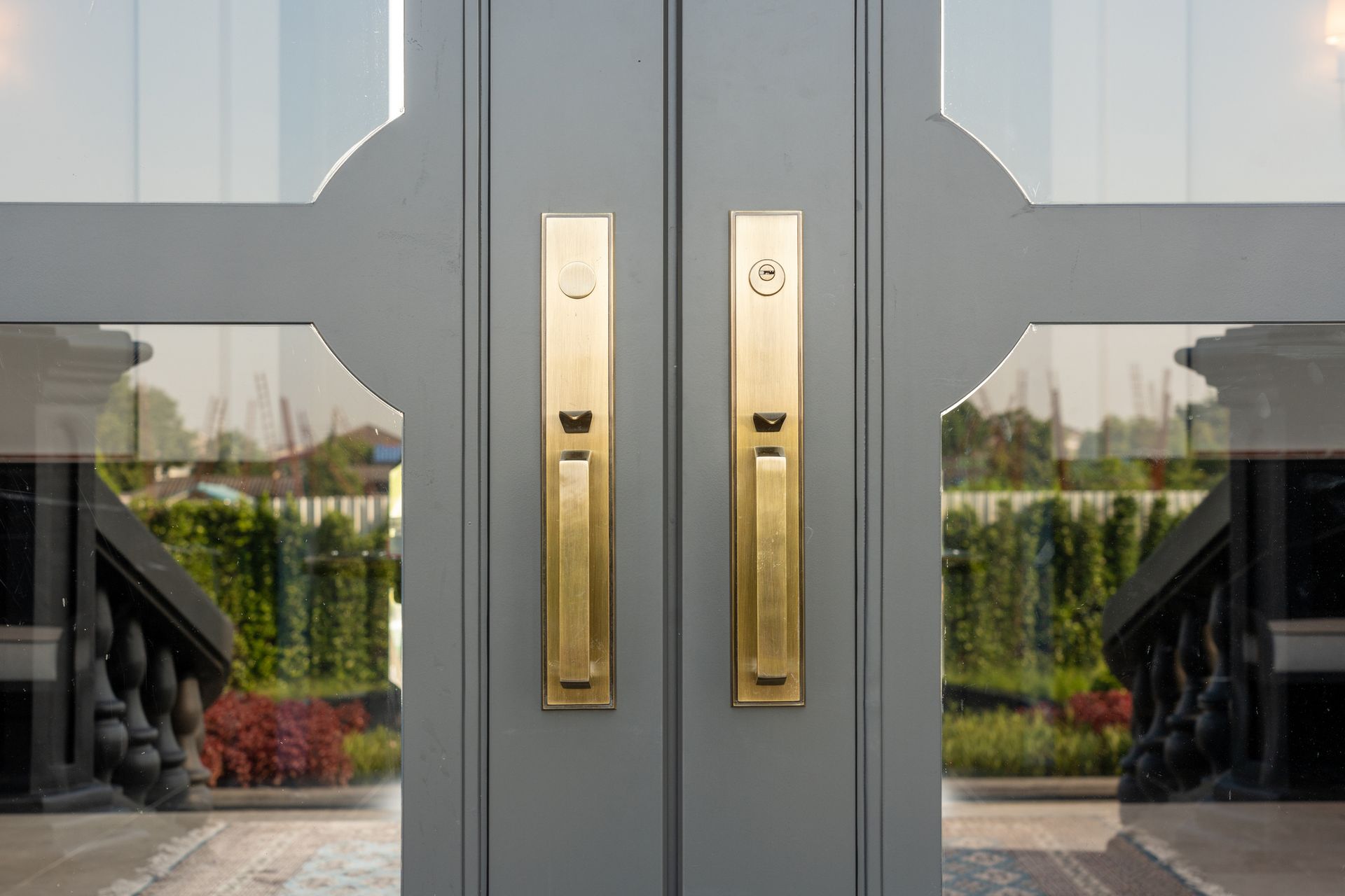 A close up of a pair of doors with brass handles Siefken Roofing and Remodeling Services in Omaha, NE