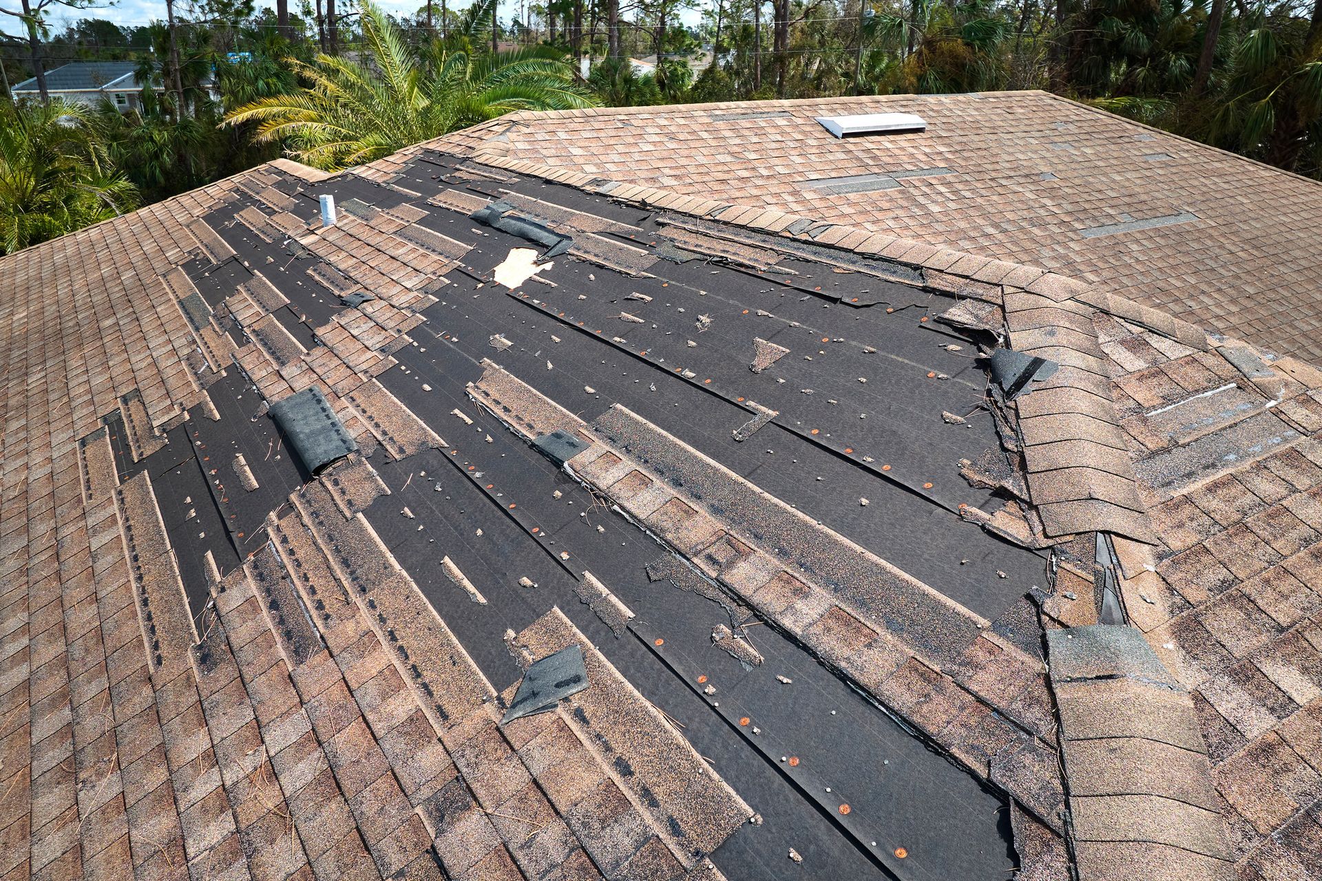 A roof with a lot of shingles on it is being repaired | Siefken Roofing and Remodeling Services in Omaha, NE