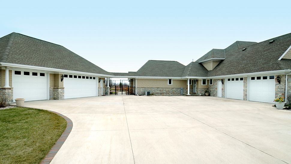 A large house with a lot of garage doors | Kitchen Projects | Siefken Roofing and Remodeling Services in Omaha, NE