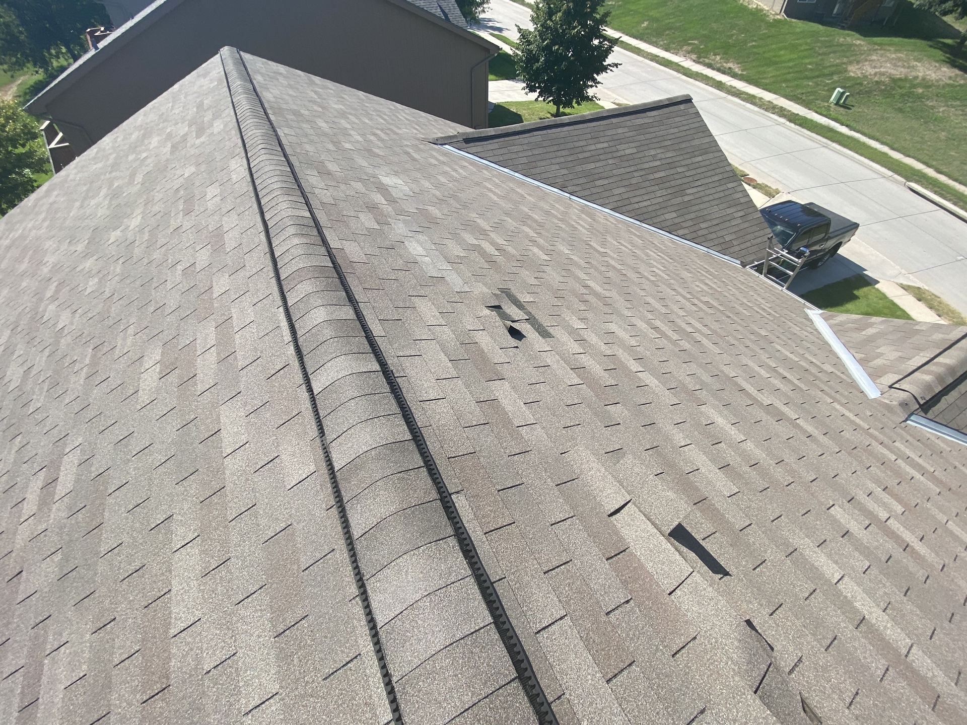 An aerial view of a roof of a house in a residential area  | Roofing Projects | Siefken Roofing and Remodeling Services in Omaha, NE