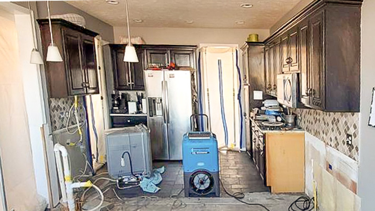 A kitchen is being remodeled with a vacuum cleaner in the middle of the room | Kitchen Projects | Siefken Roofing and Remodeling Services in Omaha, NE