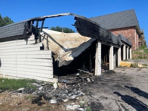 A row of burnt garages  | Fire Restoration  Projects | Siefken Roofing and Remodeling Services in Omaha, NE
