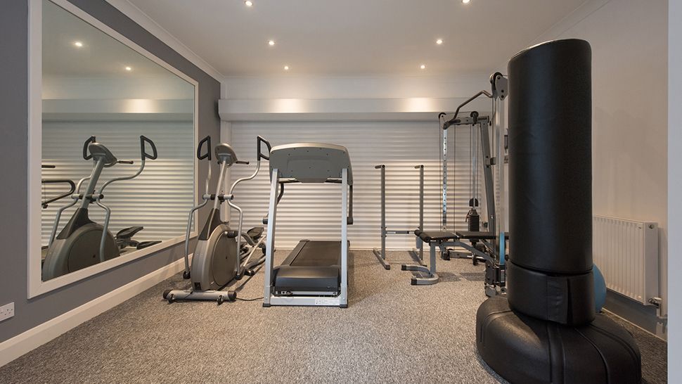 A room with gym machines | Siefken Roofing and Remodeling Services in Omaha, NE