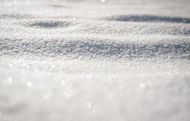 A close up of a pile of snow on a sunny day | Siefken Roofing and Remodeling Services in Omaha, NE
