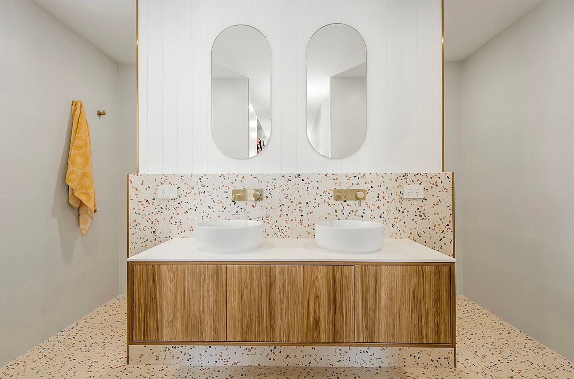Double Vanity With White Sinks, Terrazzo Backsplash and Floor — Coastbuilt Building Services in Thrumster, NSW