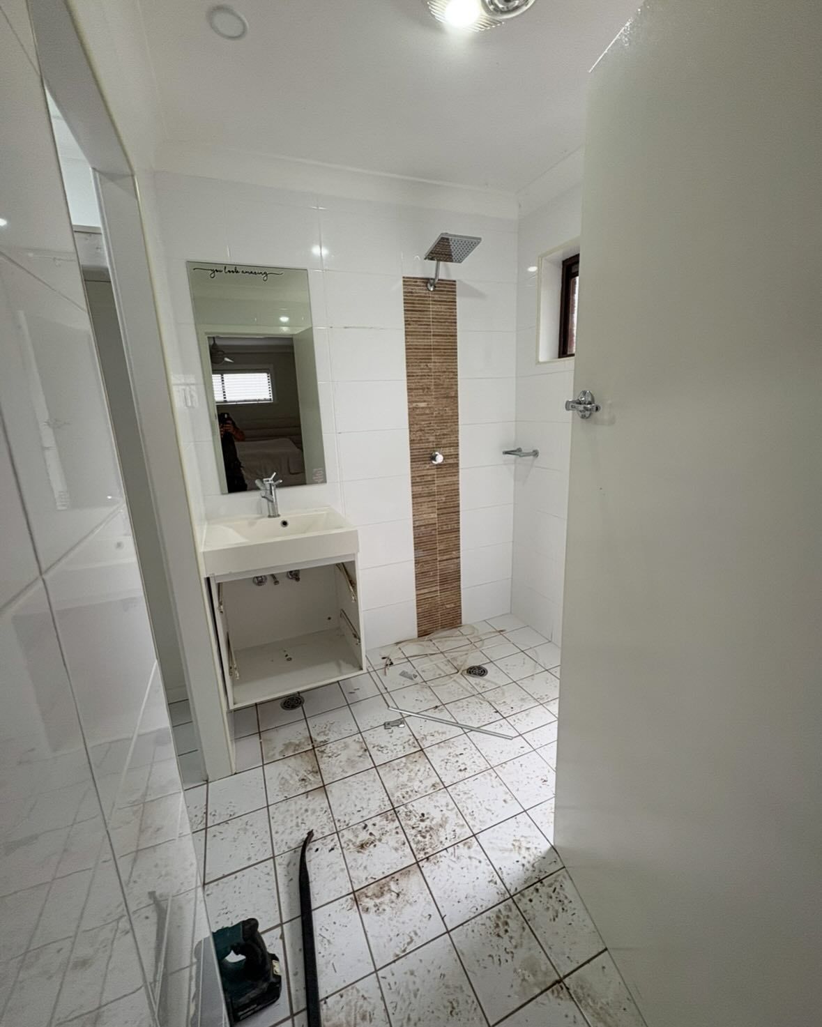 A Bathroom With a White Vanity, a Shower With a Wood-look Tile Feature — Coastbuilt Building Services in Thrumster, NSW