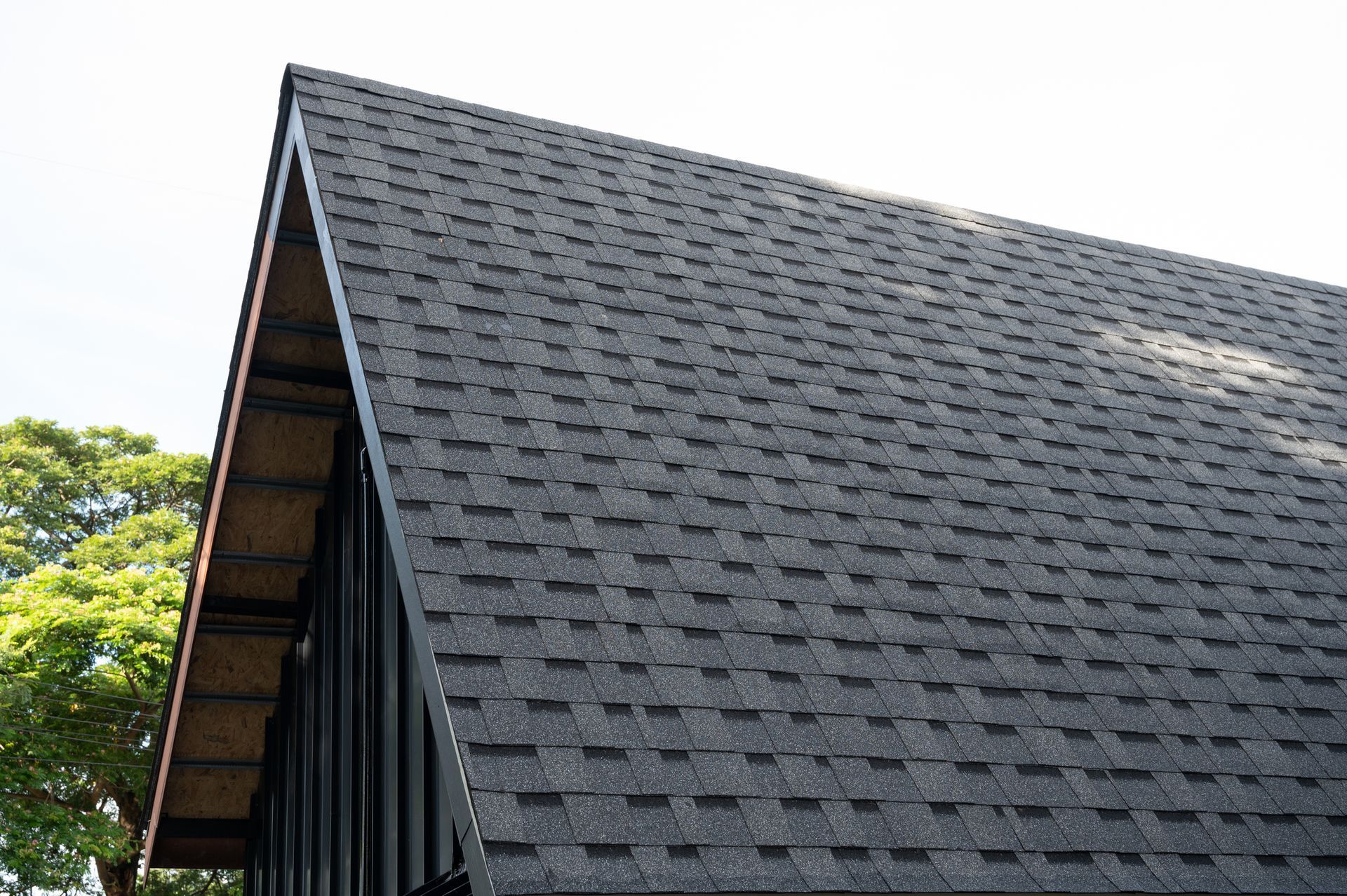 A close up of a roof with a few shingles on it