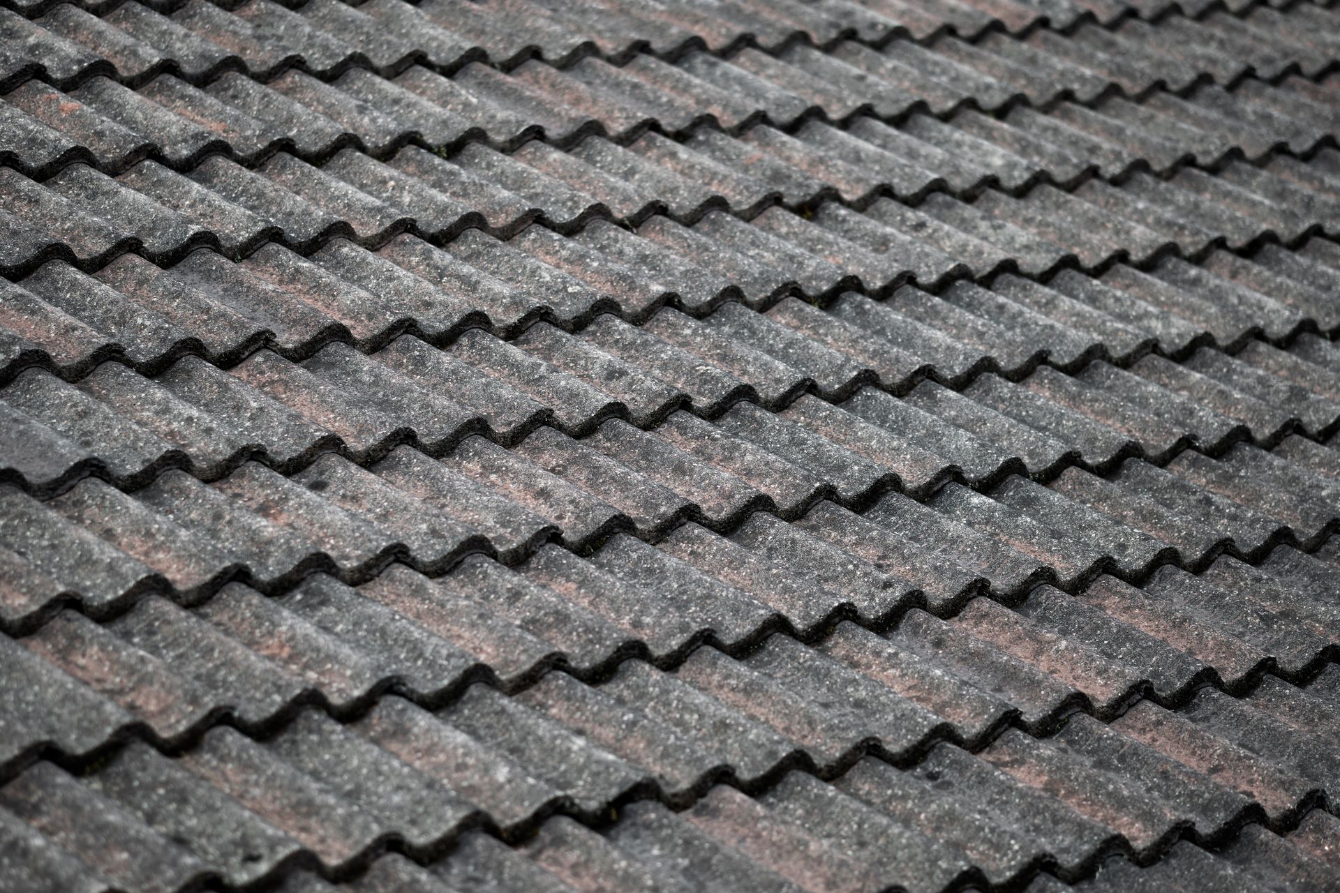 A close up of a tiled roof with a diagonal pattern.