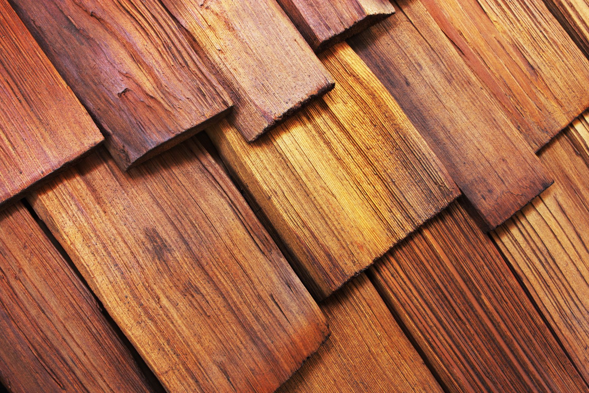 A close up of a wooden roof with shingles