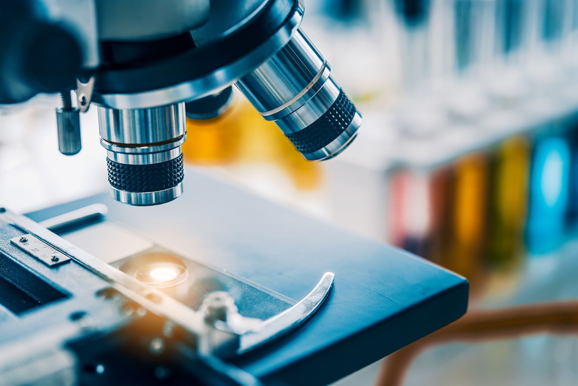 A close up of a microscope in a laboratory.
