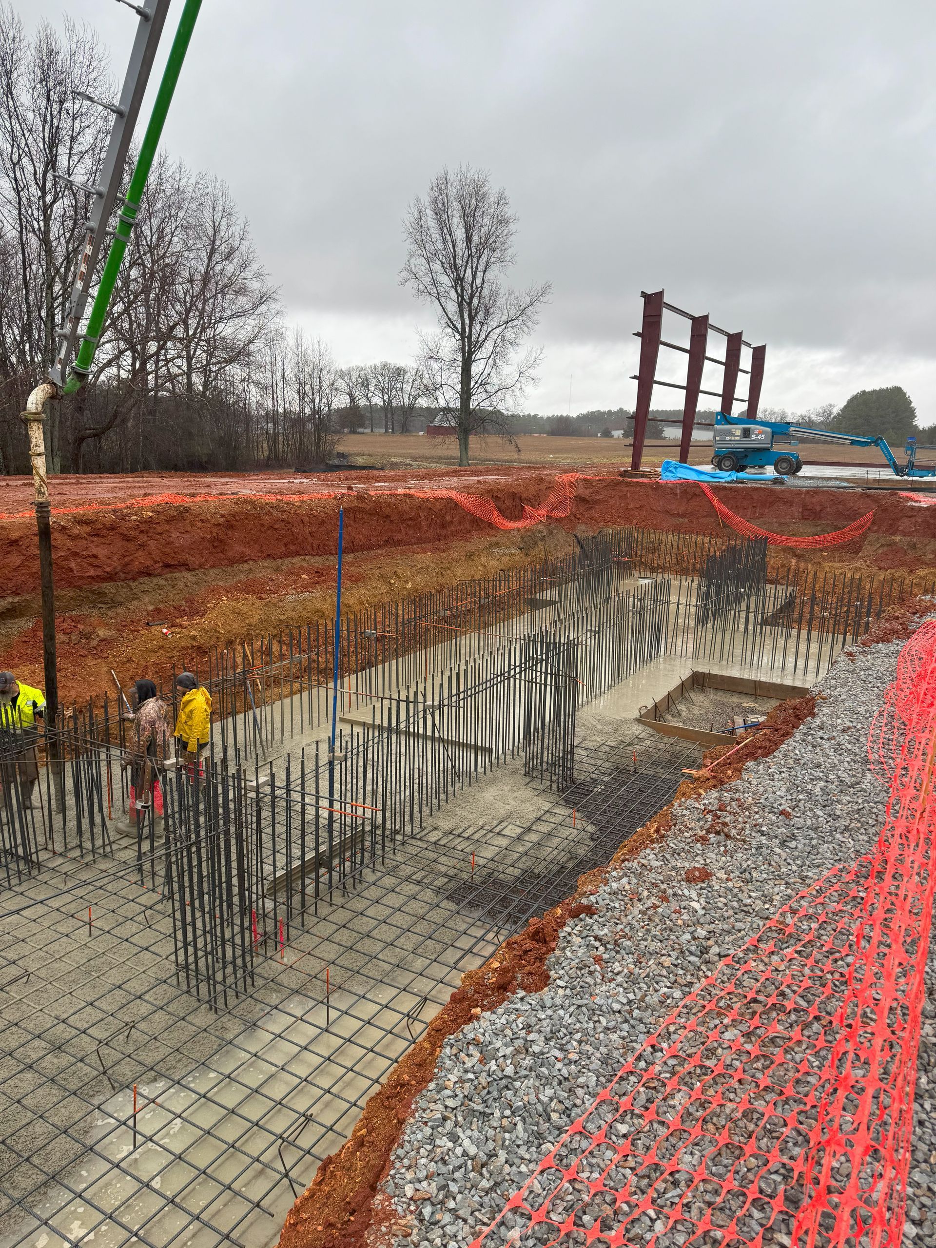 A group of construction workers are working on a construction site.