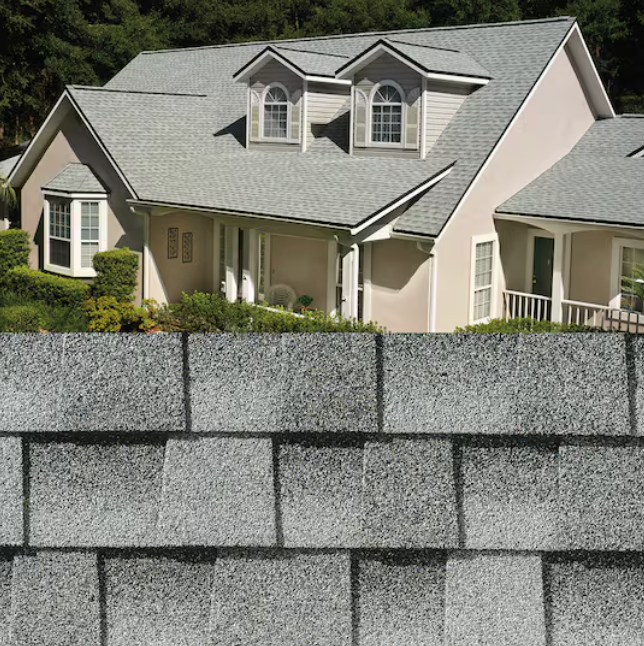 Suburban house behind a tall gray cinder block wall