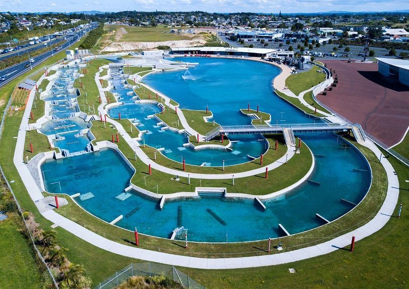 An aerial view of a large swimming pool in a park