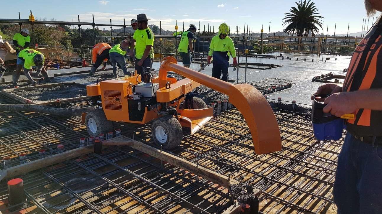 A group of construction workers are working on a construction site.
