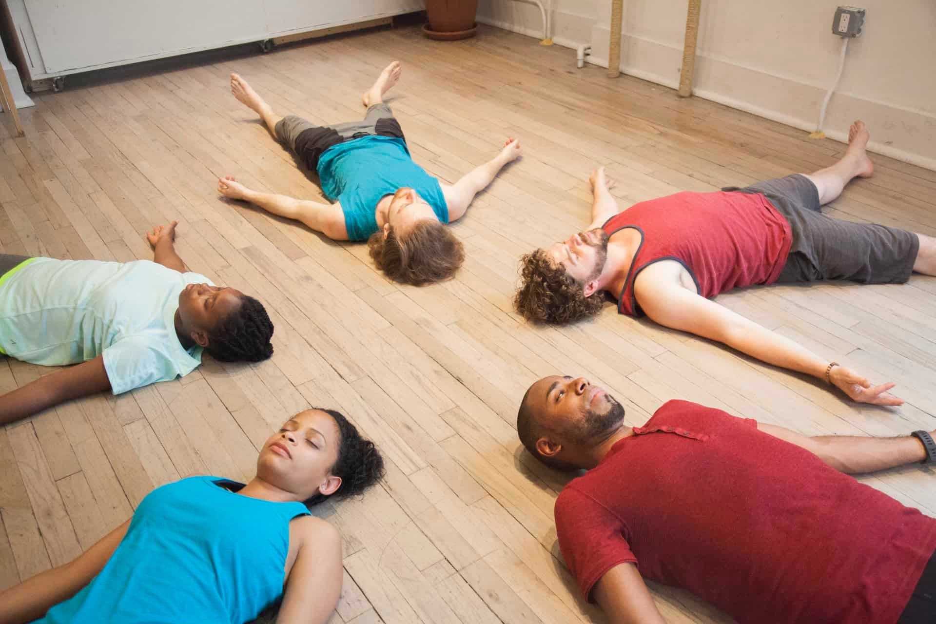 Hands arranging yoga props