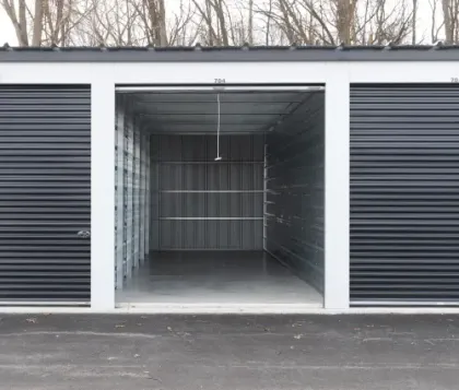 Open drive-up storage unit with roll-up door at Clarkston Self Storage in Clarkston, MI