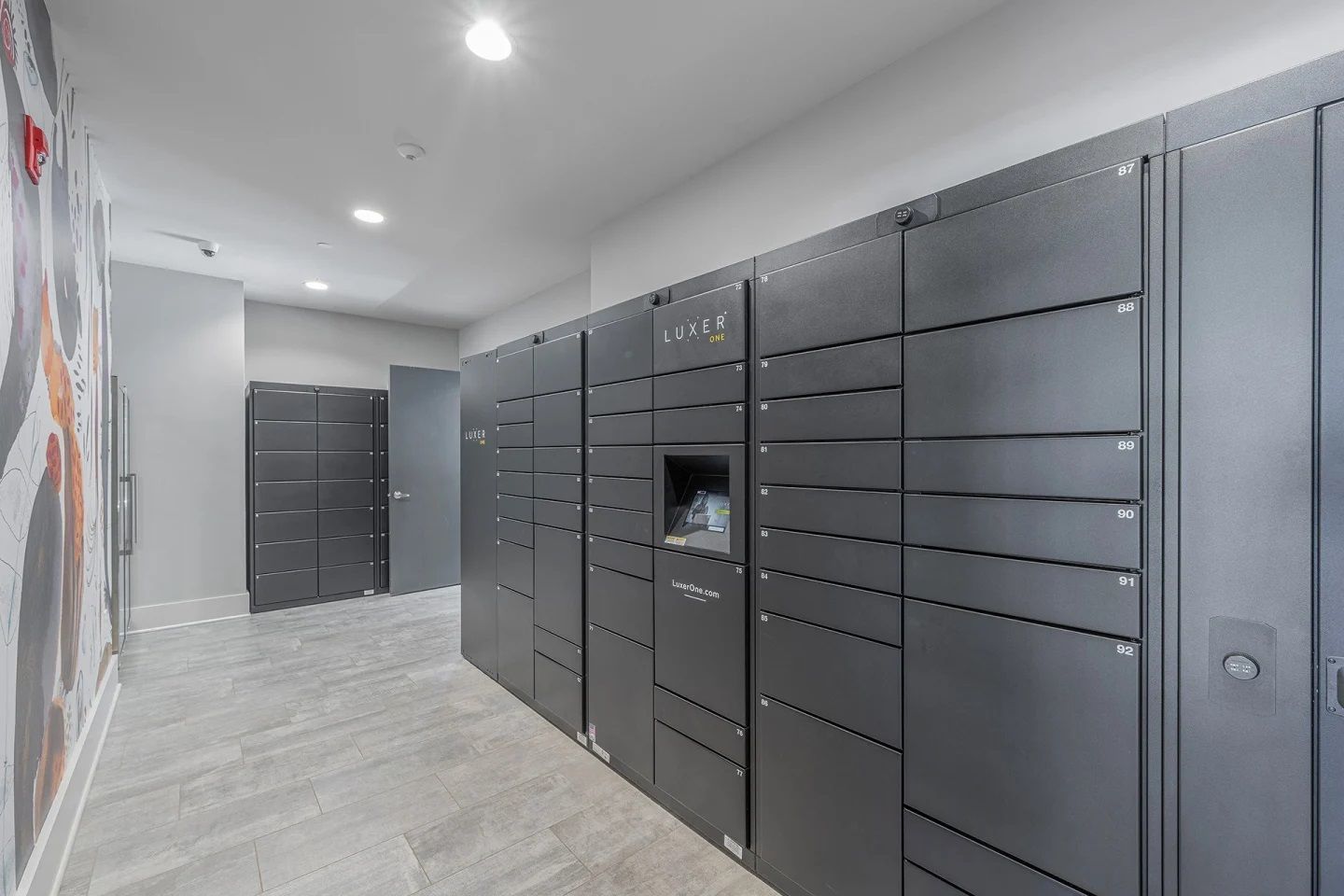 A hallway with a lot of lockers in it