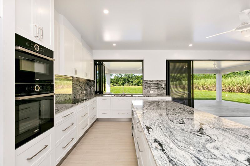 Oven and white drawers in the kitchen — Cabinetry in Cairns, QLD