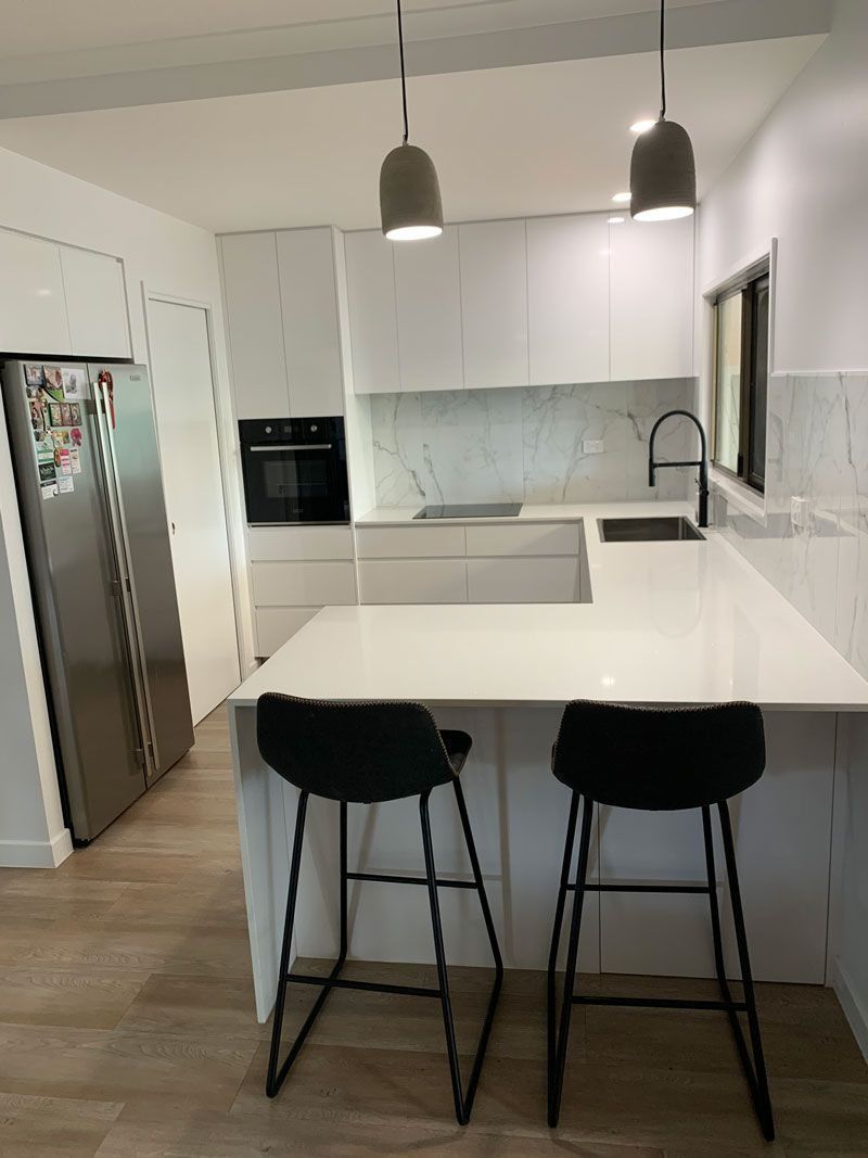 Modern Kitchen With White Cabinets in Cairns